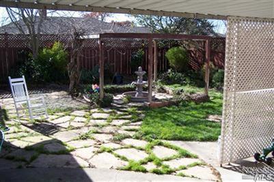 4813 Burlington Street Santa Rosa, CA 95405 - Photo 2 of 12 a view of a chair and table in backyard of the house