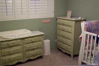 4813 Burlington Street Santa Rosa, CA 95405 - Photo 3 of 12 a bathroom with a sink and a mirror