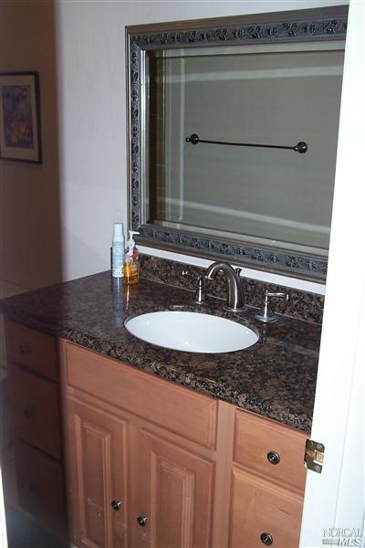 4813 Burlington Street Santa Rosa, CA 95405 - Photo 4 of 12 a bathroom with a sink and a mirror