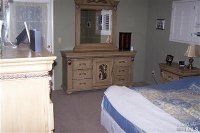 4813 Burlington Street Santa Rosa, CA 95405 - Photo 6 of 12 a bedroom with a bed and a dresser
