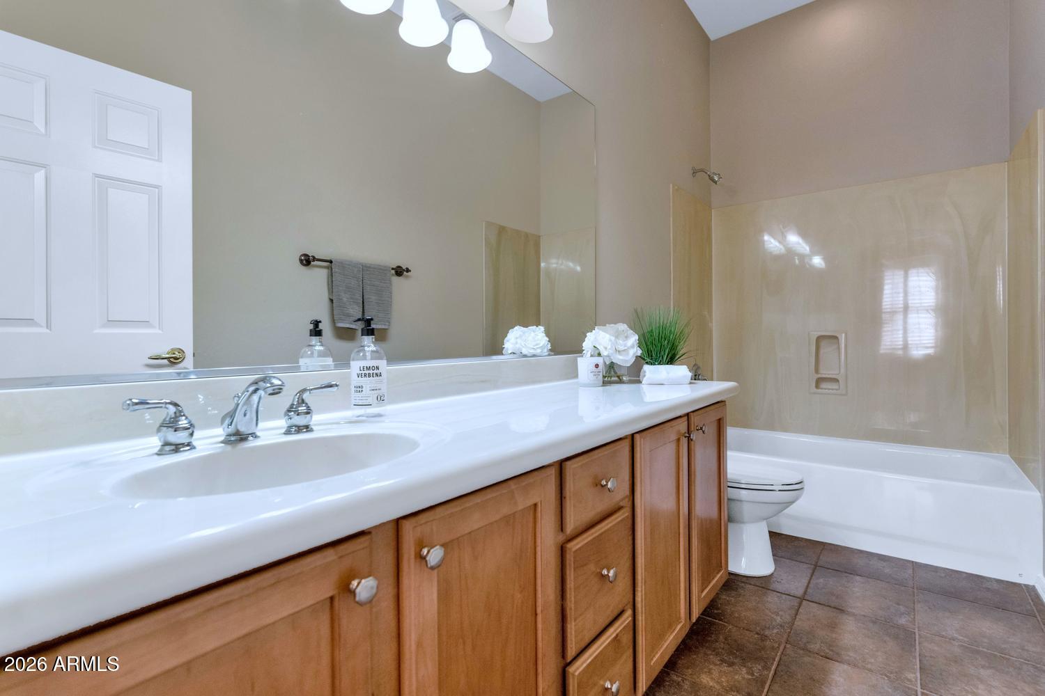 41123 North River Bend Road Phoenix, AZ 85086 - Photo 24 of 45 a bathroom with a double vanity sink toilet and a mirror