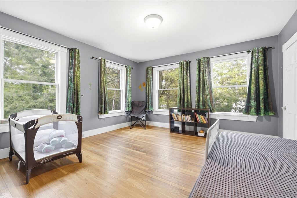 17 Wellesley Street Weston, MA 02493 - Photo 14 of 30 a living room with furniture and floor to ceiling windows