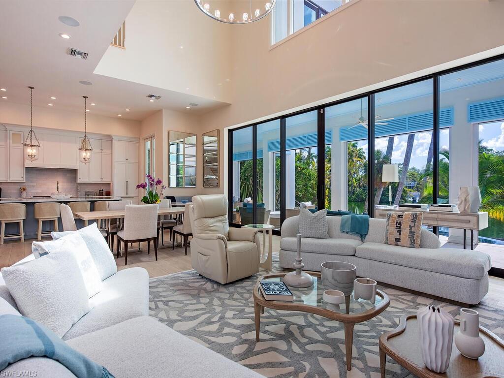 2375 Lantern Lane Naples, FL 34102 - Photo 17 of 45 a living room with furniture and a large window