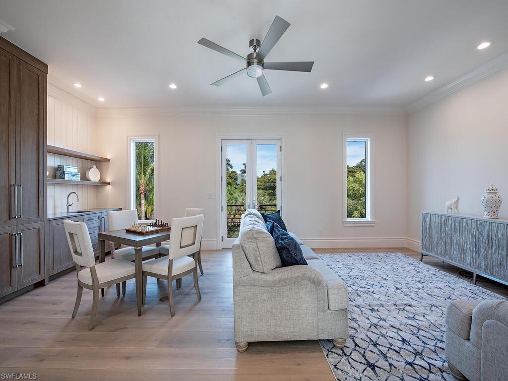 2375 Lantern Lane Naples, FL 34102 - Photo 21 of 45 a living room with furniture and a large window
