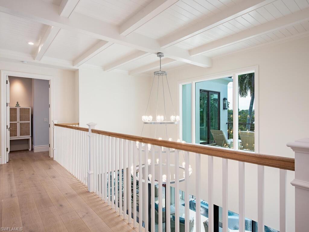 2375 Lantern Lane Naples, FL 34102 - Photo 27 of 45 a view of a hallway with wooden floor and entryway