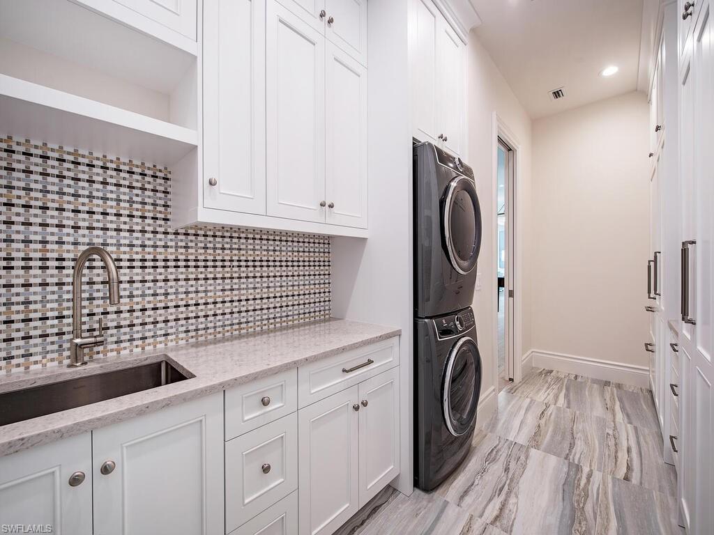 2375 Lantern Lane Naples, FL 34102 - Photo 29 of 45 a utility room with dryer and washer