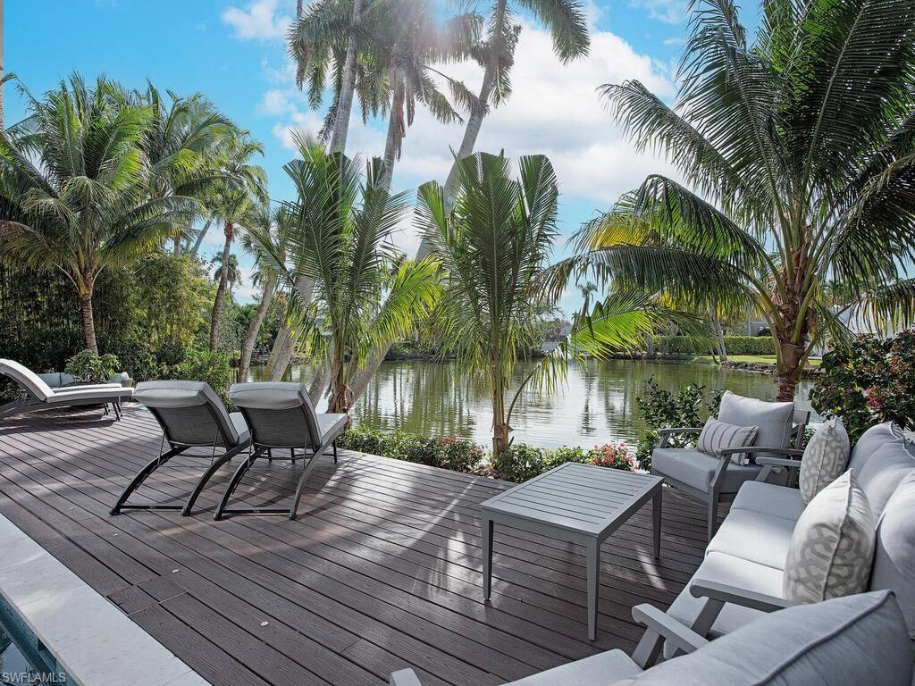 2375 Lantern Lane Naples, FL 34102 - Photo 32 of 45 a view of a patio with couches and a fire pit