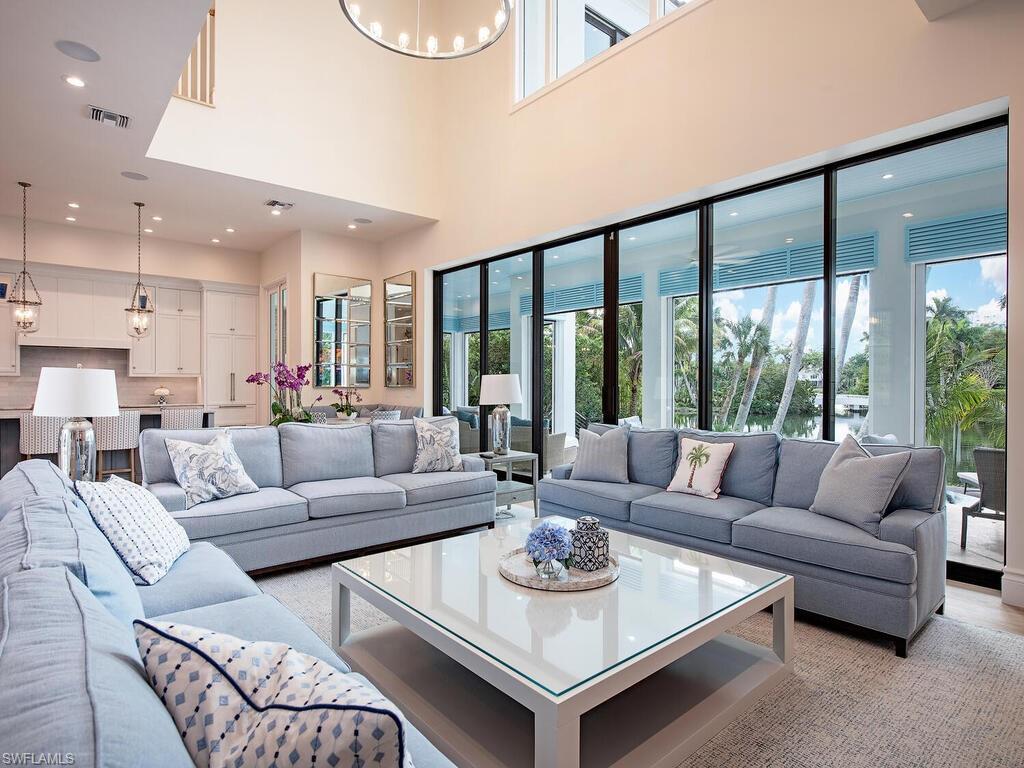 2375 Lantern Lane Naples, FL 34102 - Photo 33 of 45 a living room with furniture and a large window