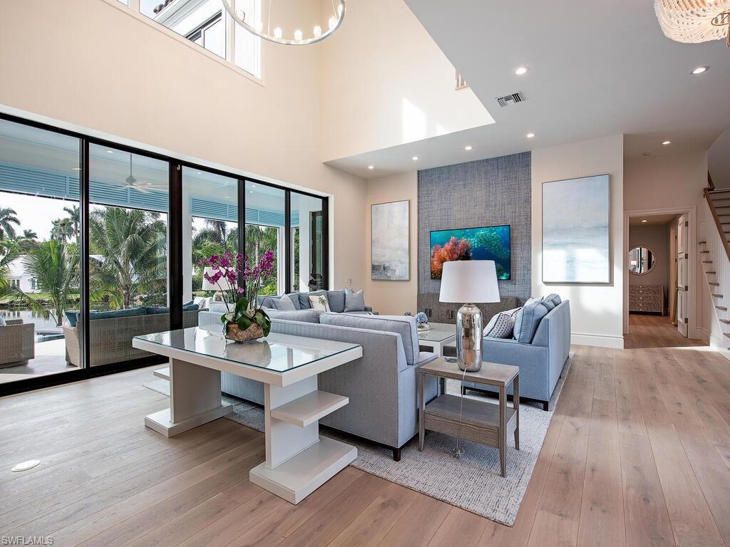 2375 Lantern Lane Naples, FL 34102 - Photo 34 of 45 a living room with furniture and a large window