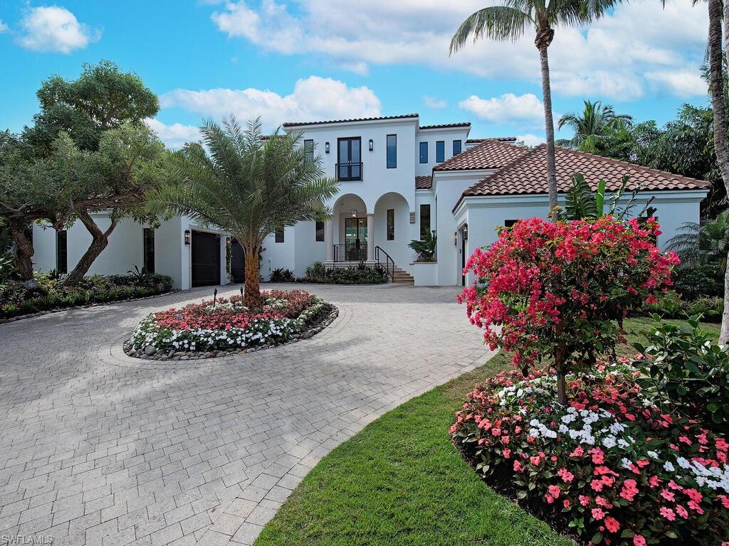 2375 Lantern Lane Naples, FL 34102 - Photo 41 of 45 a front view of a house with a yard