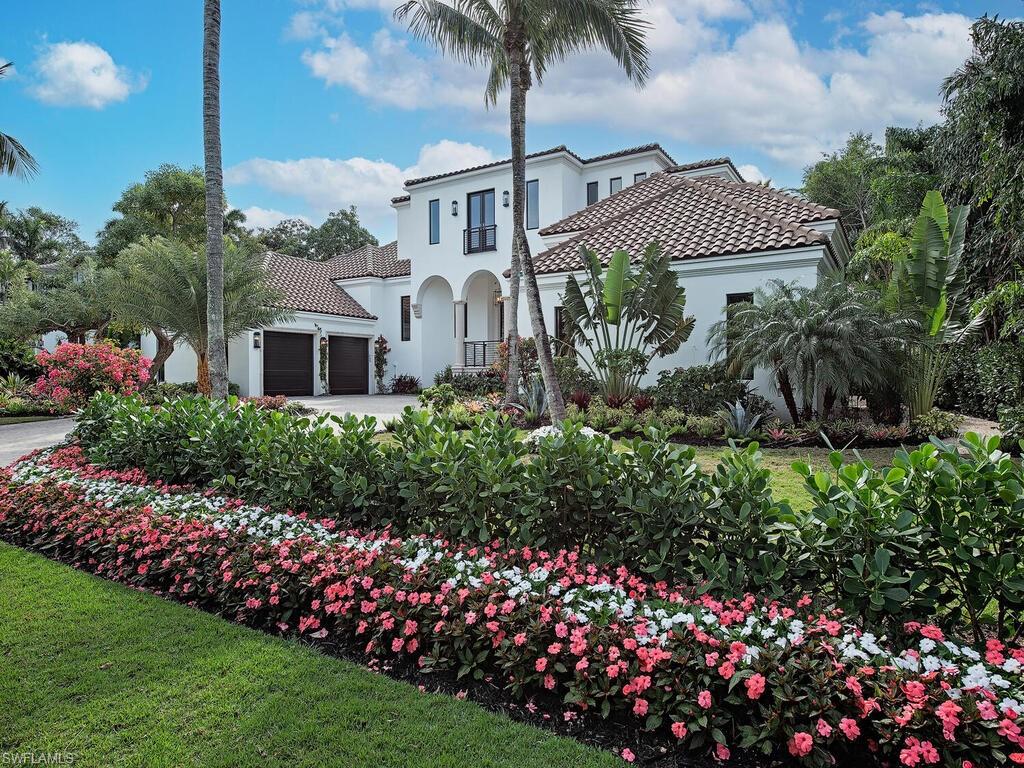 2375 Lantern Lane Naples, FL 34102 - Photo 45 of 45 a view of a house with a yard and potted plants