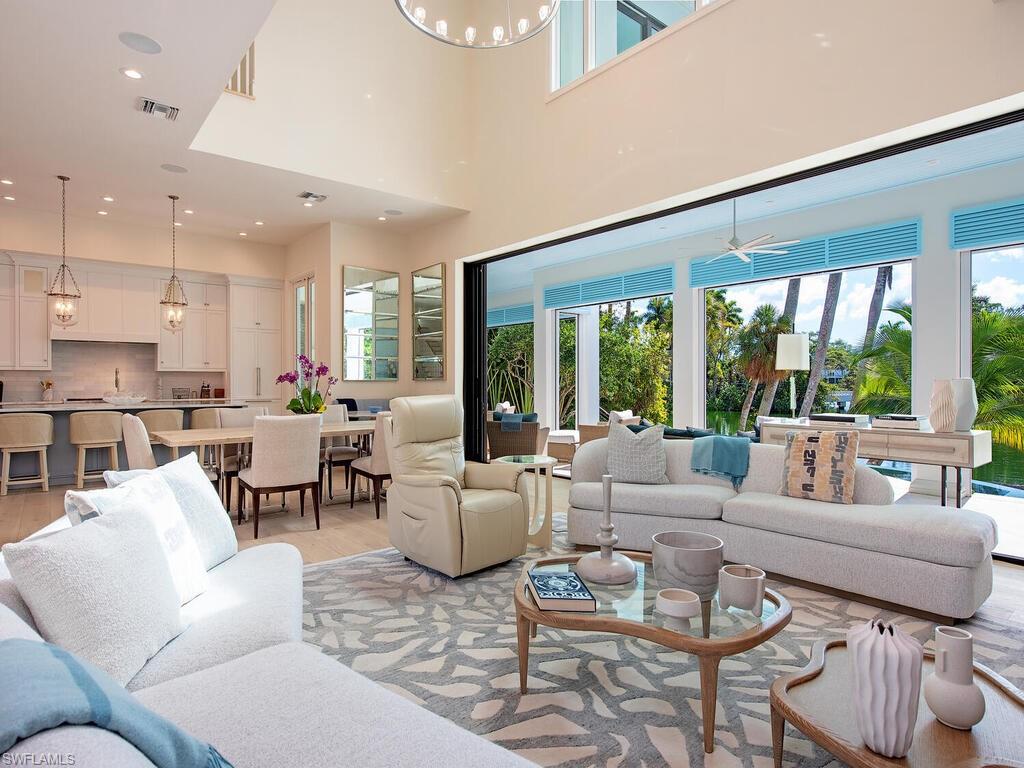2375 Lantern Lane Naples, FL 34102 - Photo 5 of 45 a living room with furniture and a large window