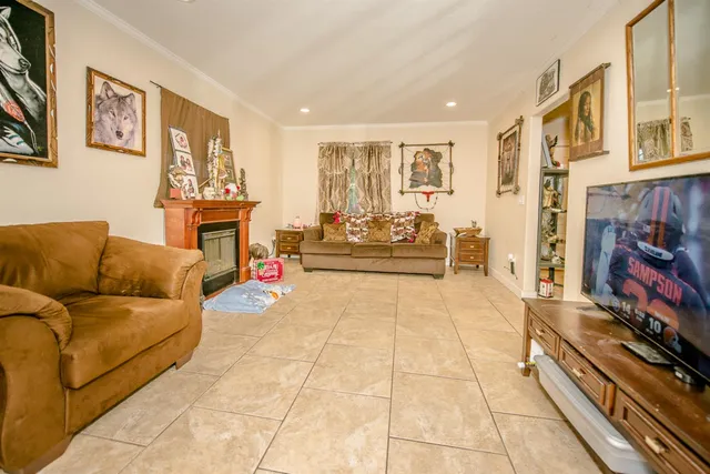 a dining room filled with lots of chairs and chandelier