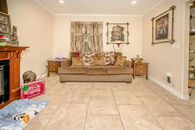 a dining room with furniture and wooden floor