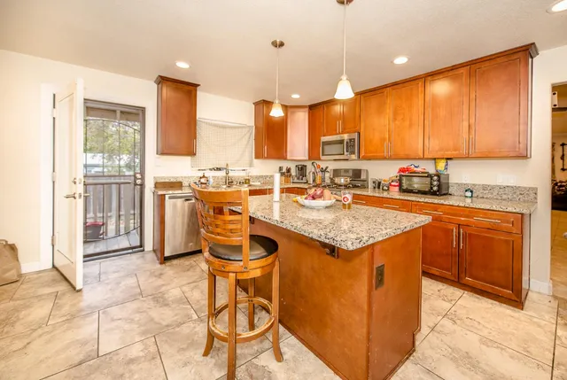 a view of a bathroom with a tub and shower