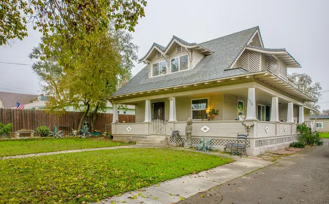 a front view of house with yard and green space
