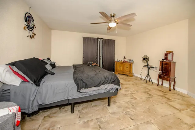 a view of walk in closet with clothes