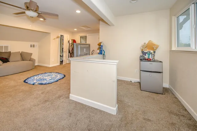 a bathroom with a glass door shower and a bathroom