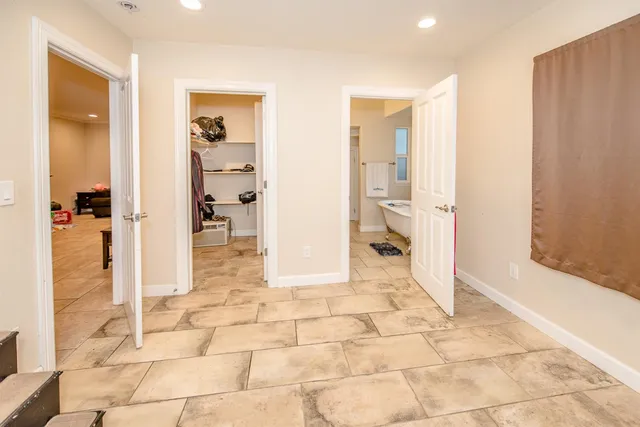 a bed room with a bed and a television