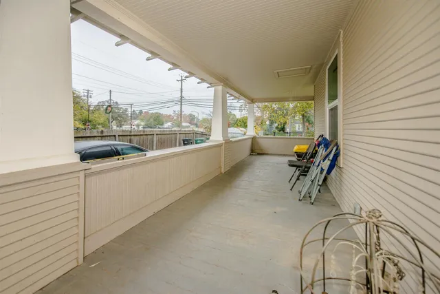 a room with furniture and large windows