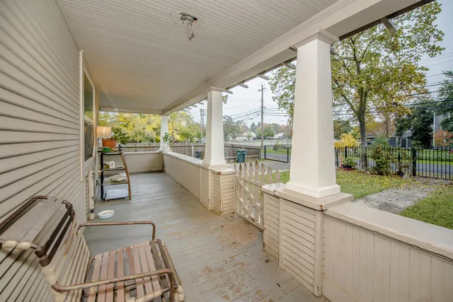 a balcony with view of outdoor space