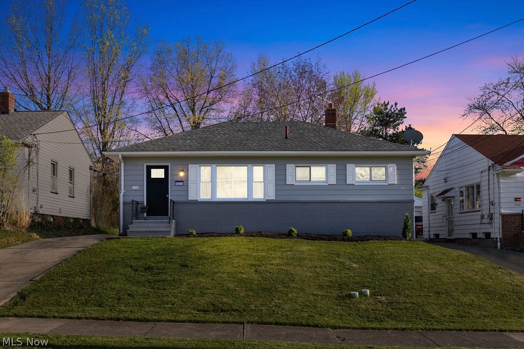 View of front of house featuring a lawn