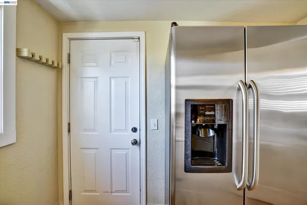 a bathroom with a glass door shower and a sink