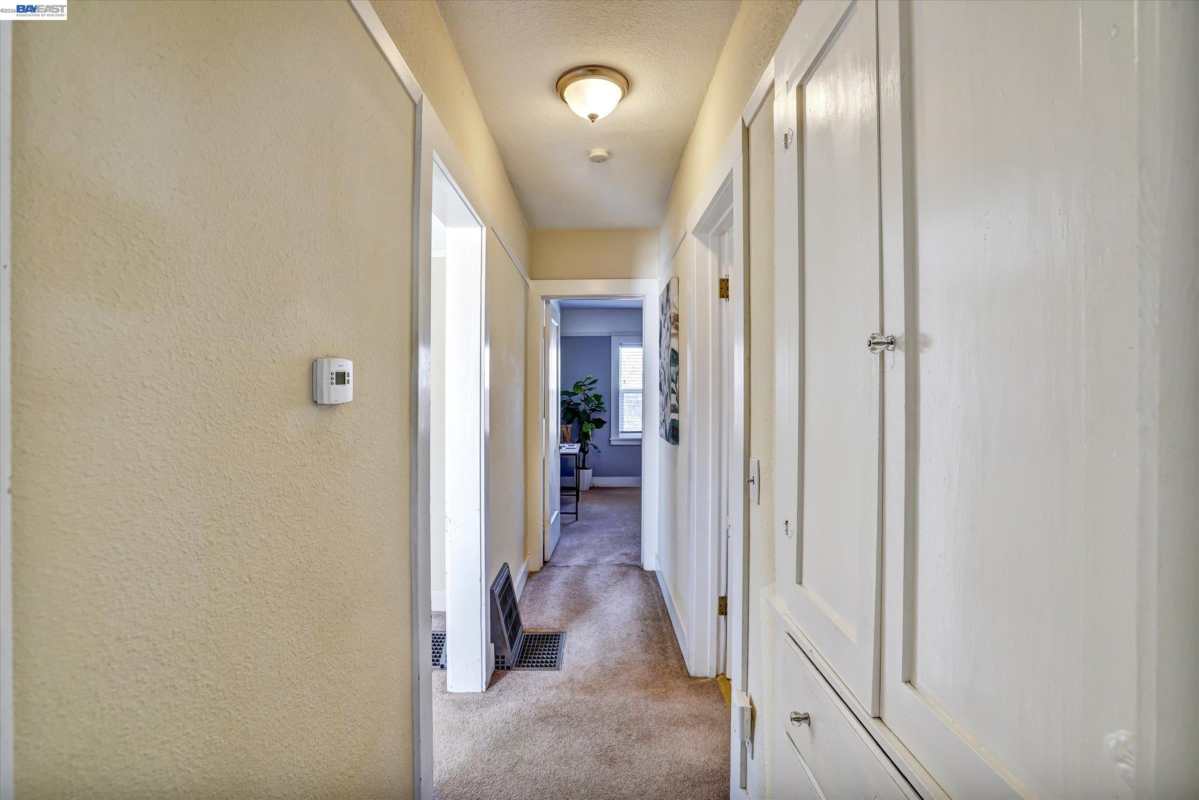 445 West Lowell Avenue Tracy, CA 95376 - Photo 24 of 44 a view of a hallway with wooden floor and staircase