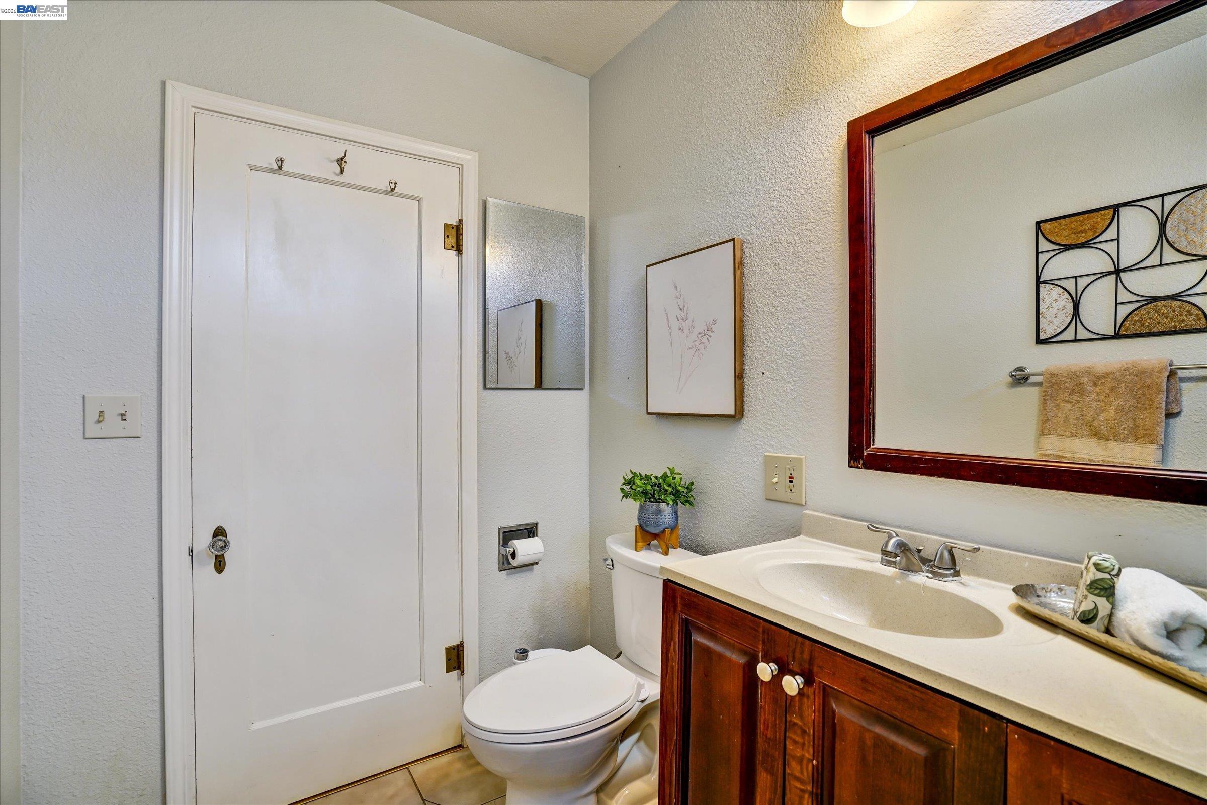 445 West Lowell Avenue Tracy, CA 95376 - Photo 26 of 44 a bathroom with a granite countertop sink toilet and shower