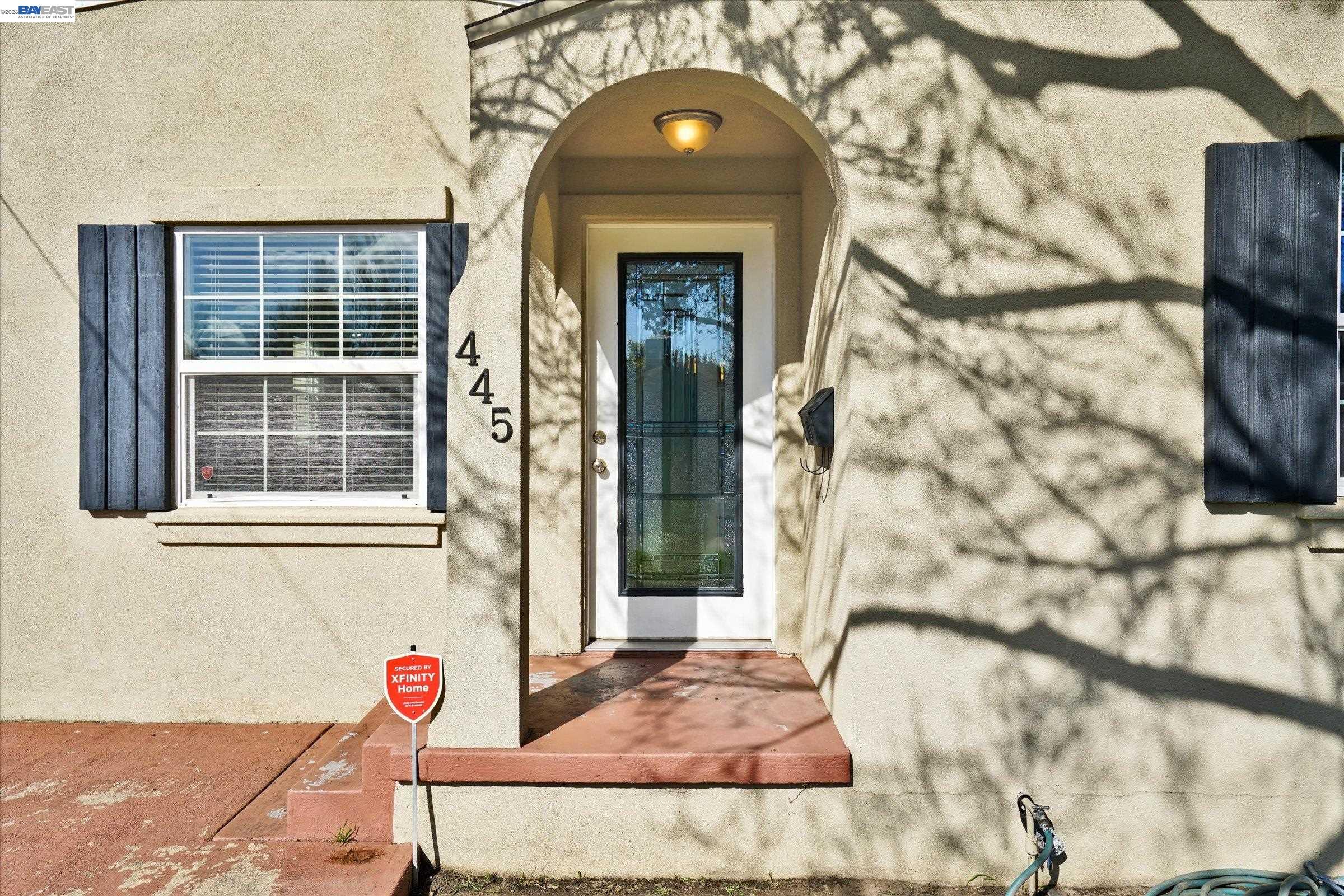 445 West Lowell Avenue Tracy, CA 95376 - Photo 3 of 44 a front view of a house with a garage