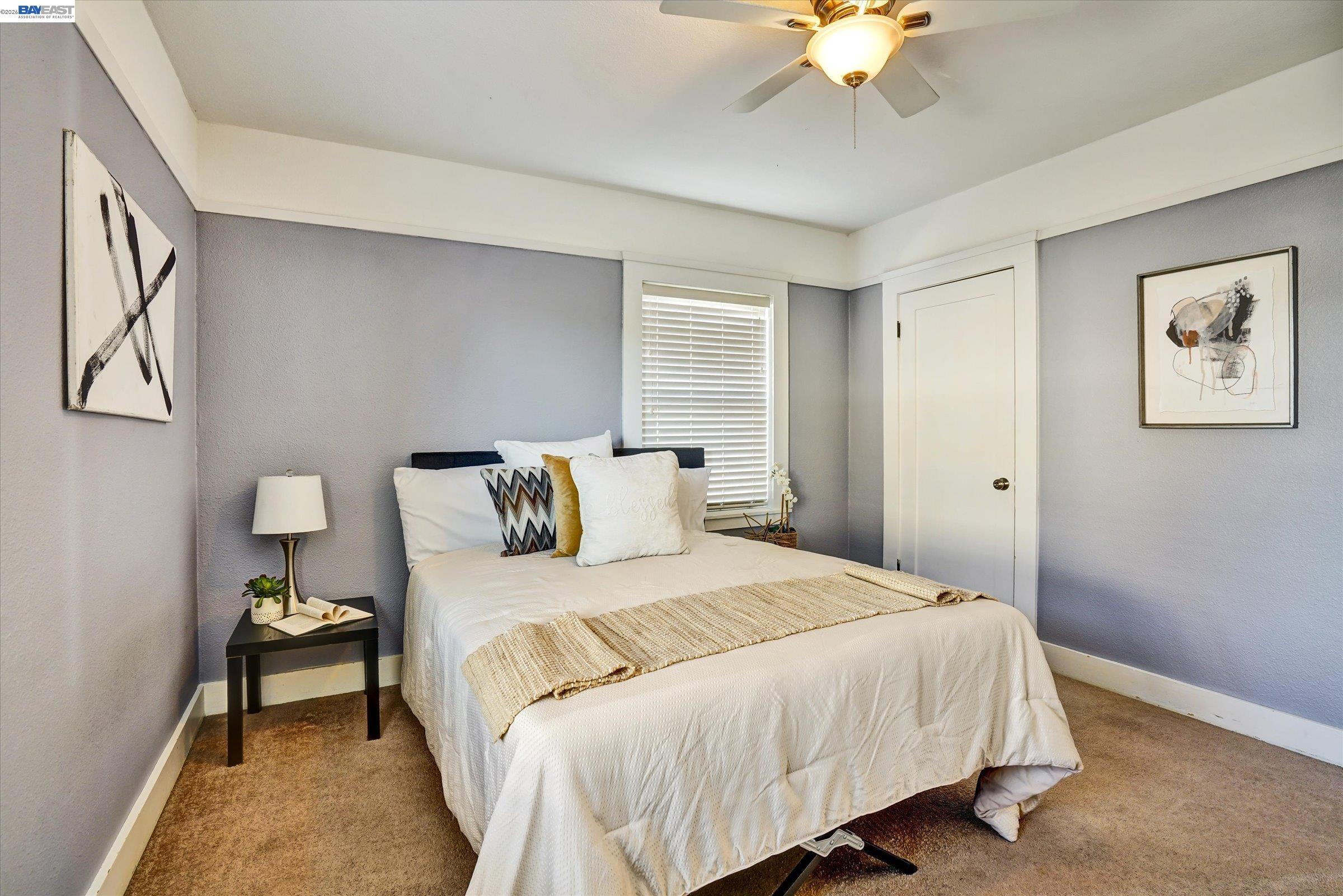 445 West Lowell Avenue Tracy, CA 95376 - Photo 31 of 44 a bedroom with a bed and a chandelier