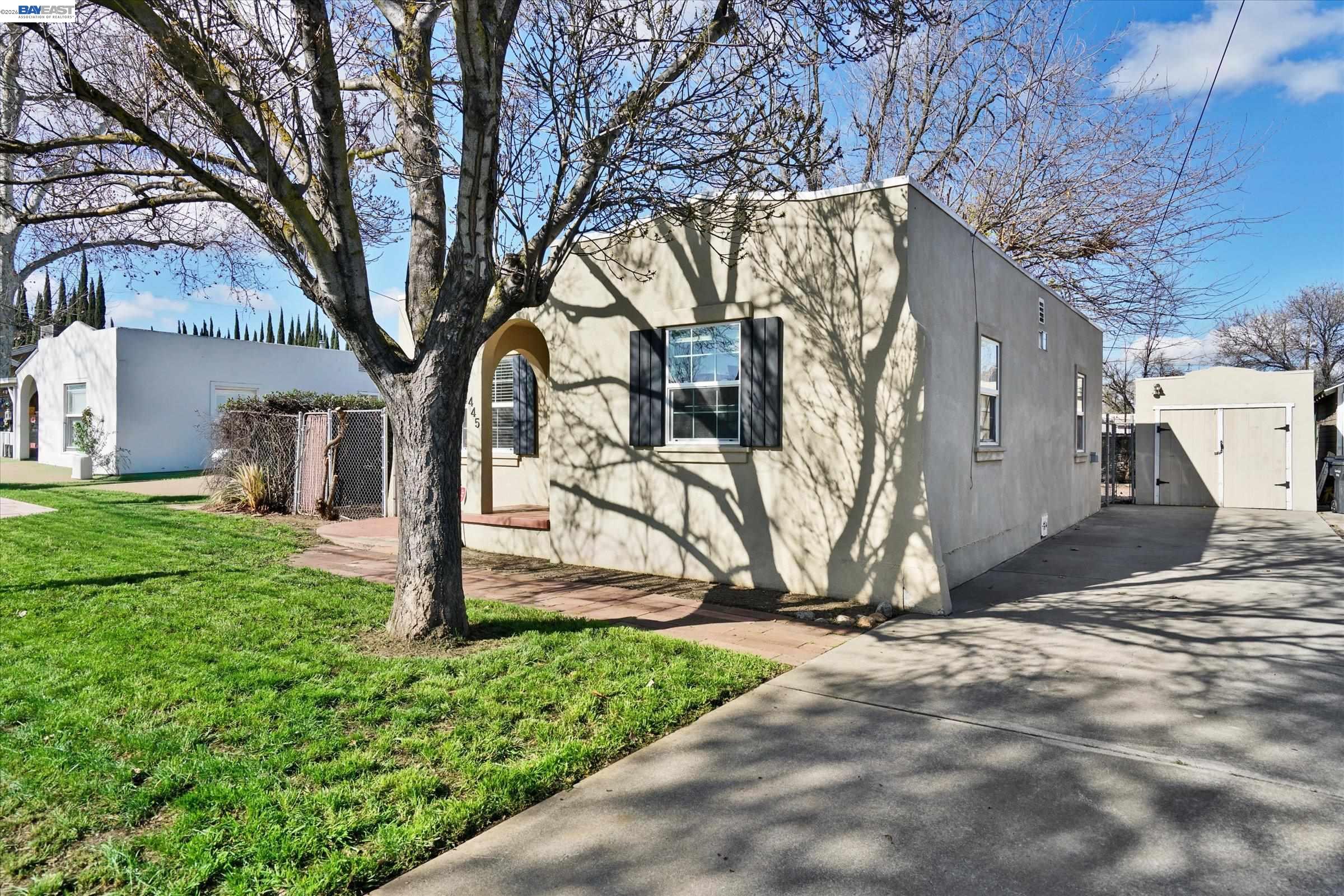 445 West Lowell Avenue Tracy, CA 95376 - Photo 38 of 44 a view of a backyard with large trees