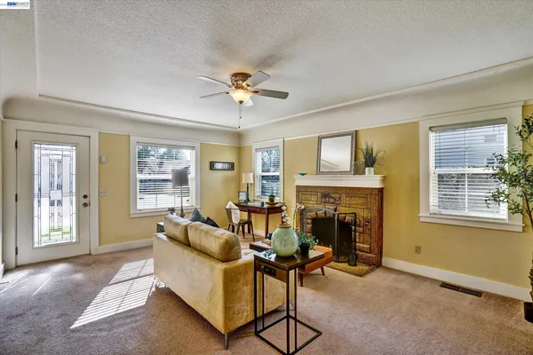a living room with furniture and a fireplace