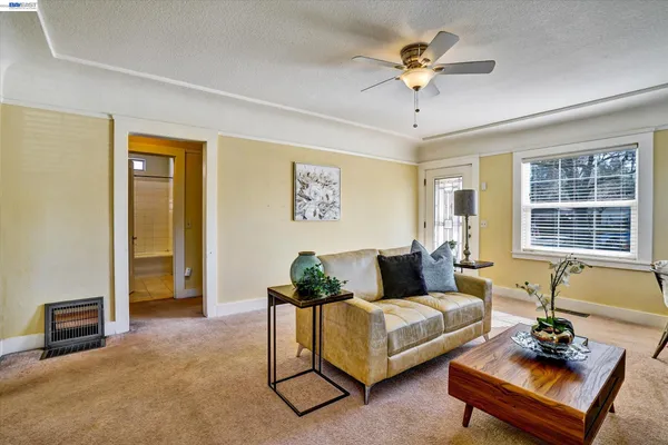 a living room with furniture and a window