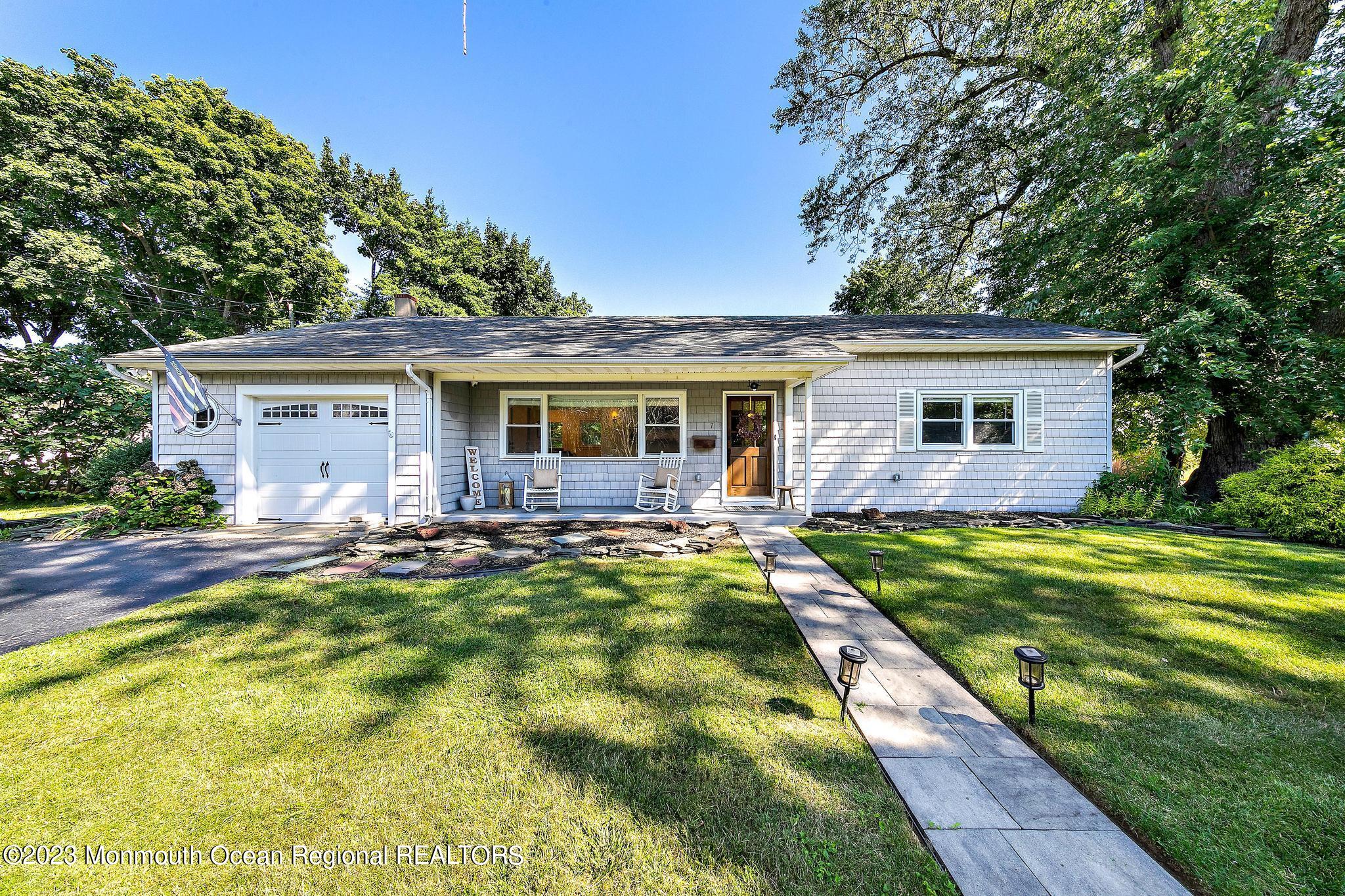 a view of a house with a backyard patio and a small yard