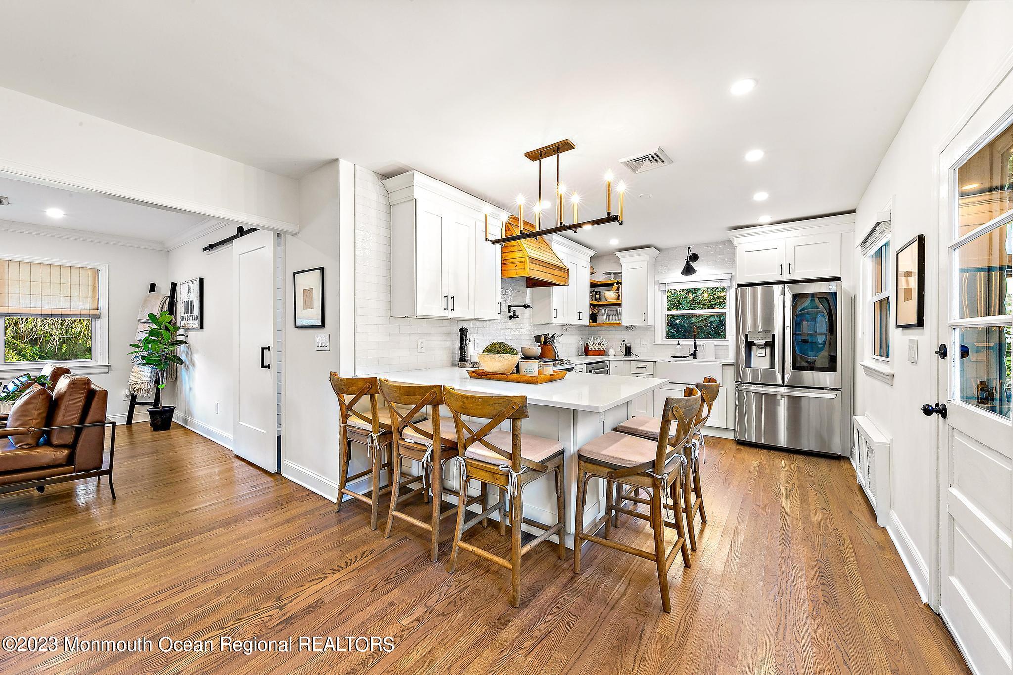7 Sagamore Avenue Oceanport, NJ 07757 - Photo 12 of 44 a dining room with stainless steel appliances kitchen island granite countertop a dining table chairs and view kitchen