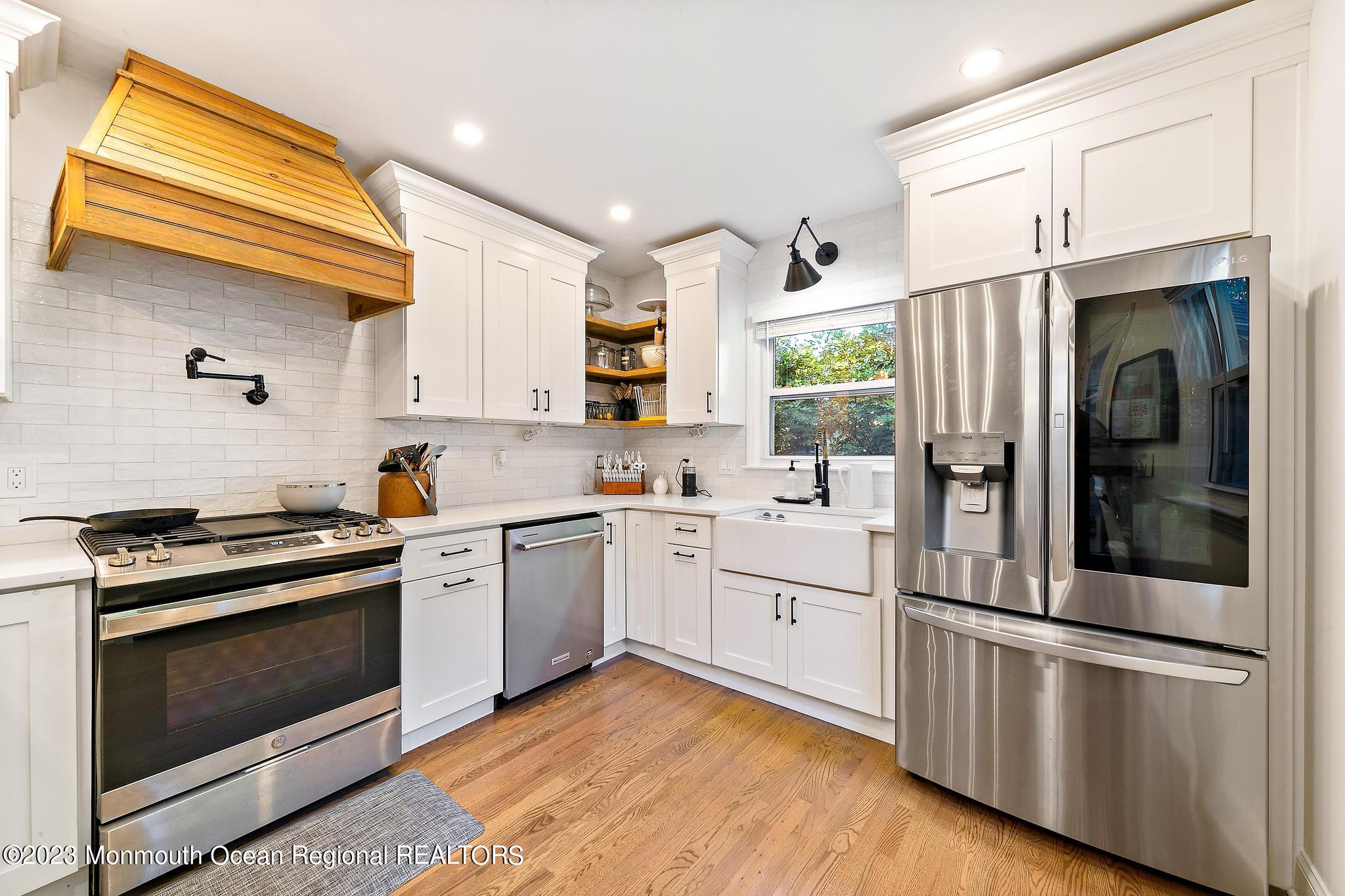 7 Sagamore Avenue Oceanport, NJ 07757 - Photo 14 of 44 a kitchen with stainless steel appliances granite countertop a stove a refrigerator and a microwave