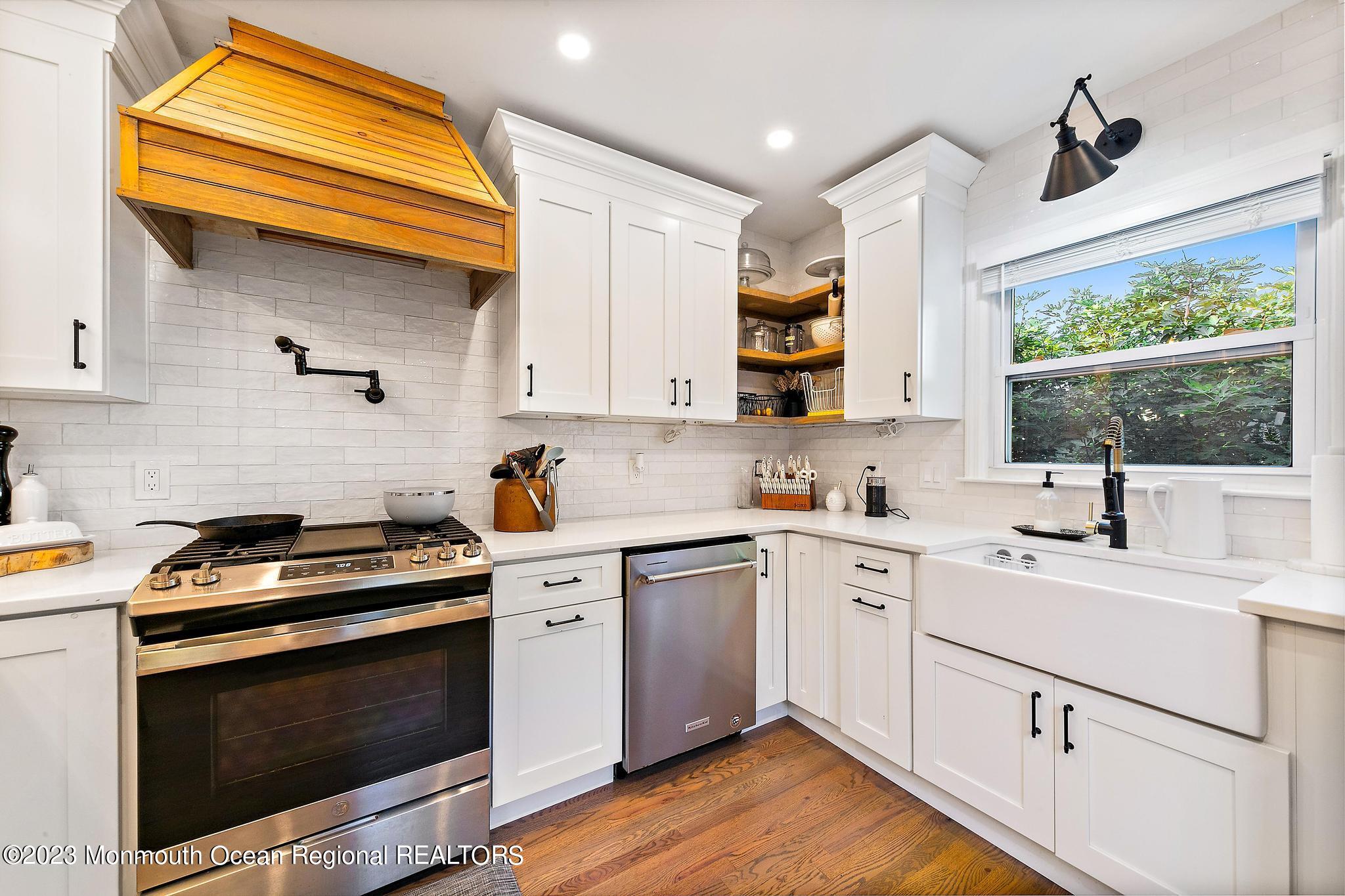 7 Sagamore Avenue Oceanport, NJ 07757 - Photo 15 of 44 a kitchen with a sink stove and cabinets