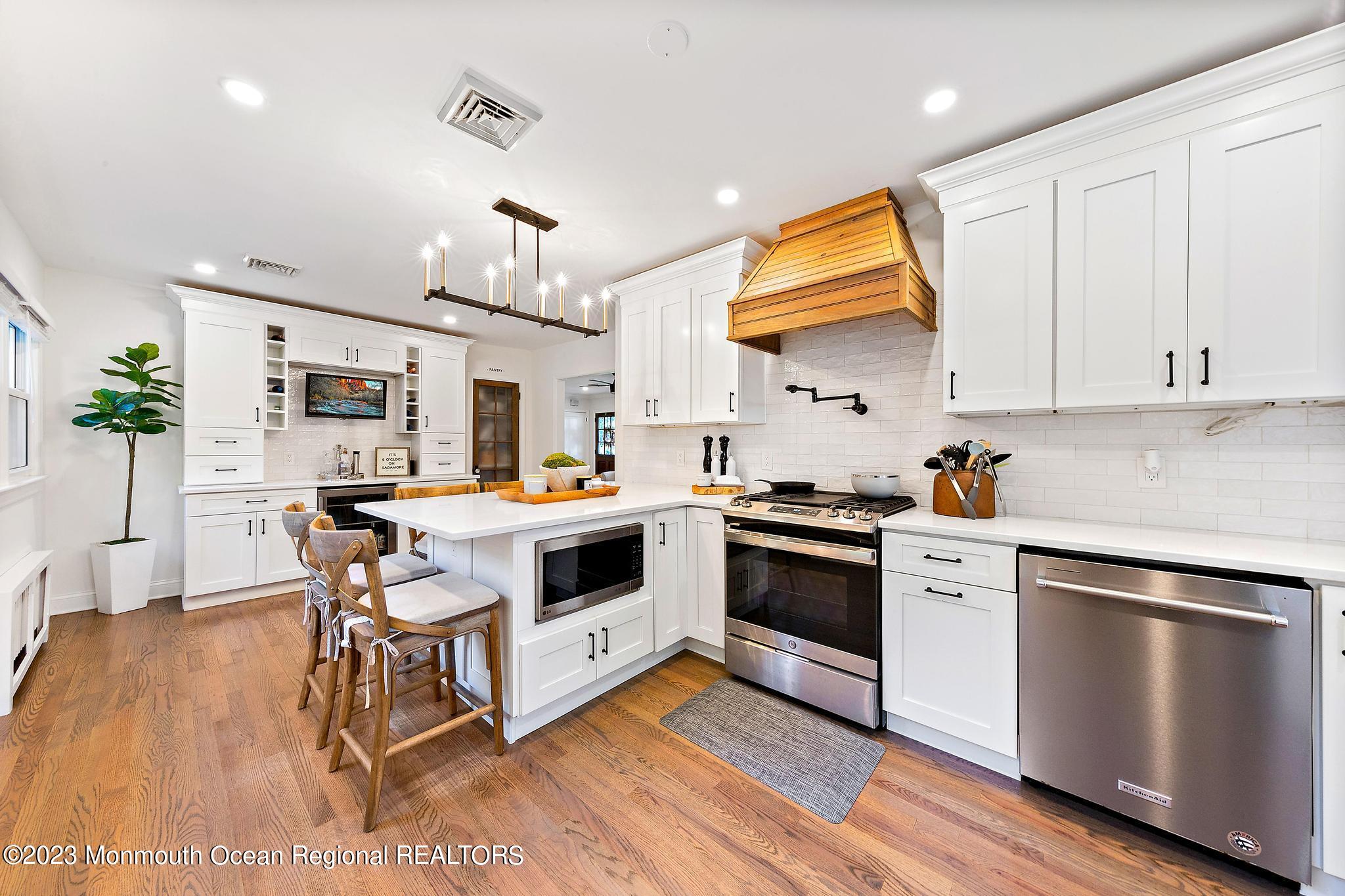 7 Sagamore Avenue Oceanport, NJ 07757 - Photo 16 of 44 a kitchen with a stove and a refrigerator
