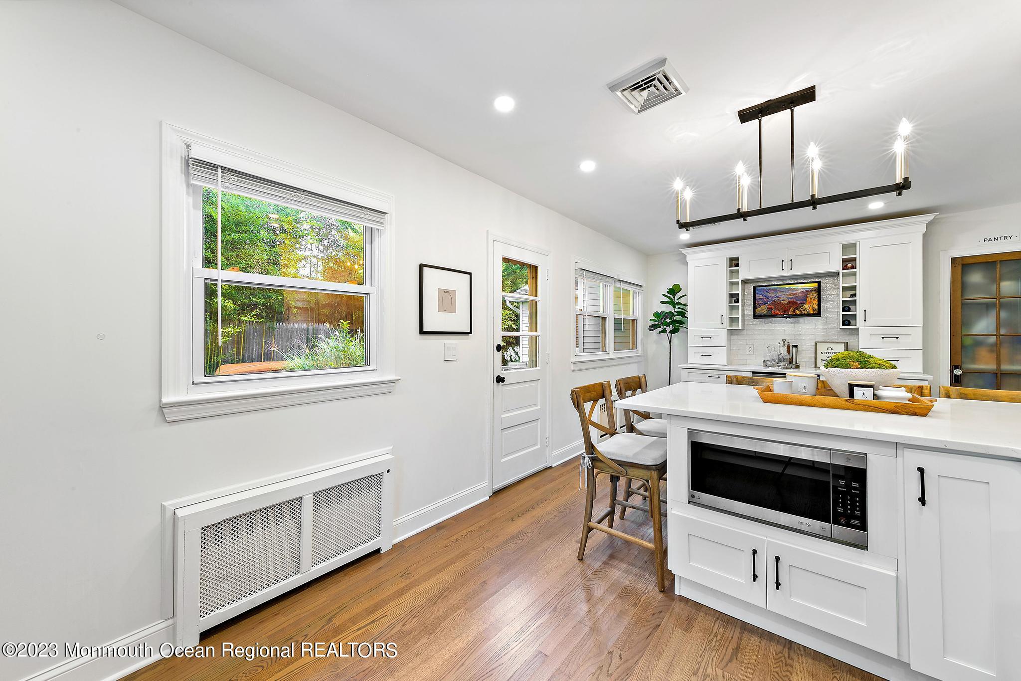7 Sagamore Avenue Oceanport, NJ 07757 - Photo 18 of 44 a kitchen that has a table chairs and wooden floor