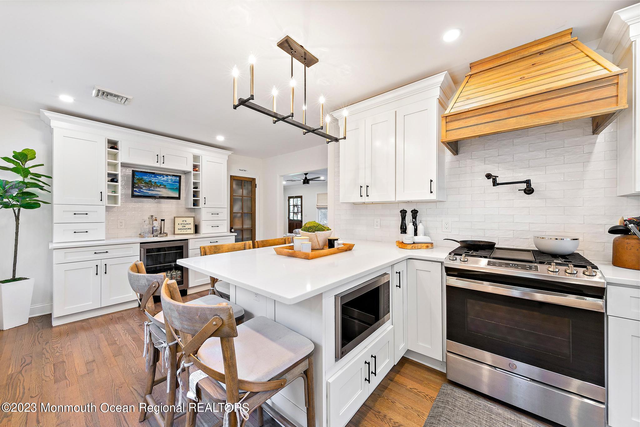 7 Sagamore Avenue Oceanport, NJ 07757 - Photo 19 of 44 a kitchen with a stove cabinets and wooden floor