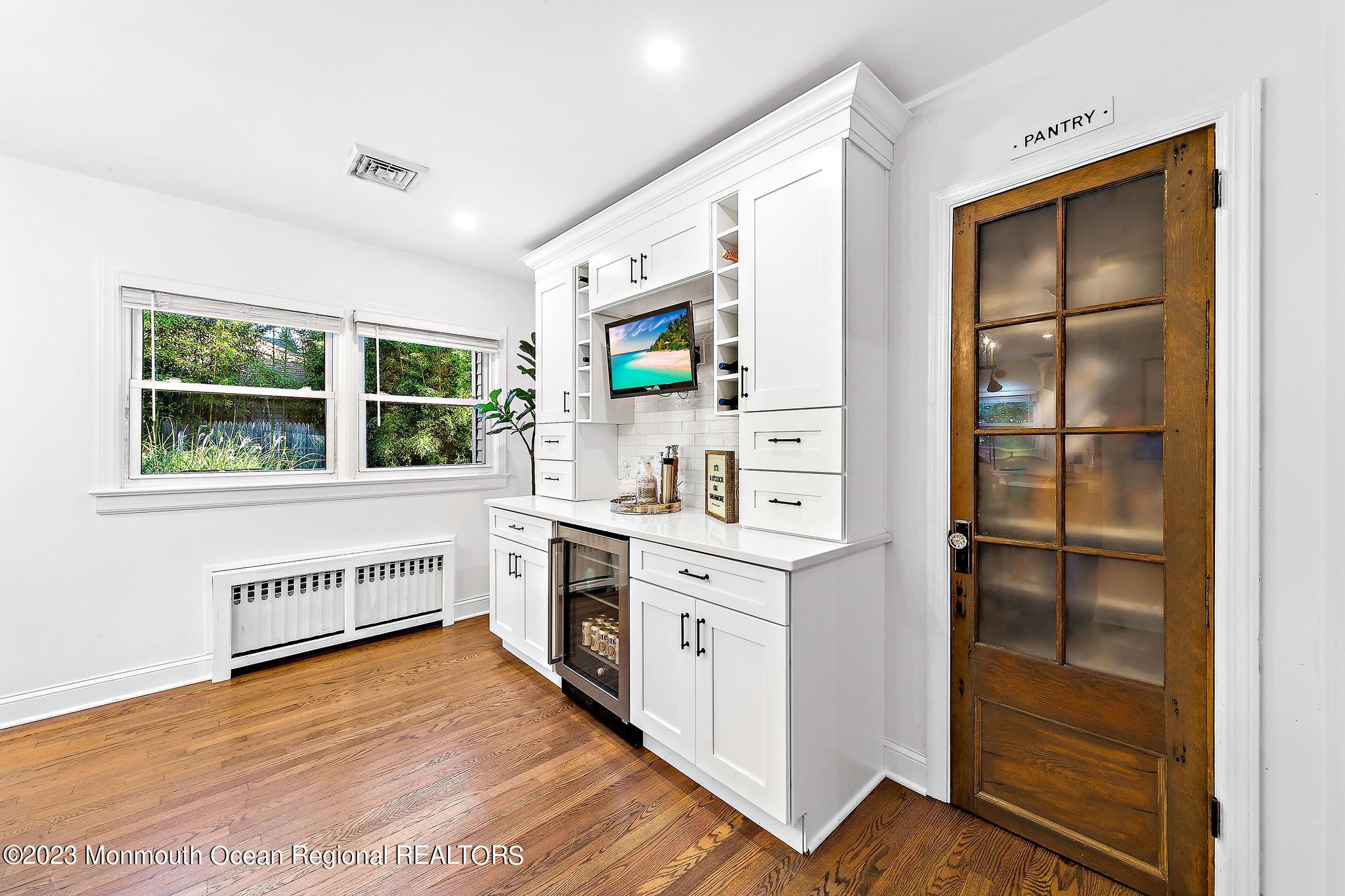 7 Sagamore Avenue Oceanport, NJ 07757 - Photo 20 of 44 a kitchen with a refrigerator and white cabinets