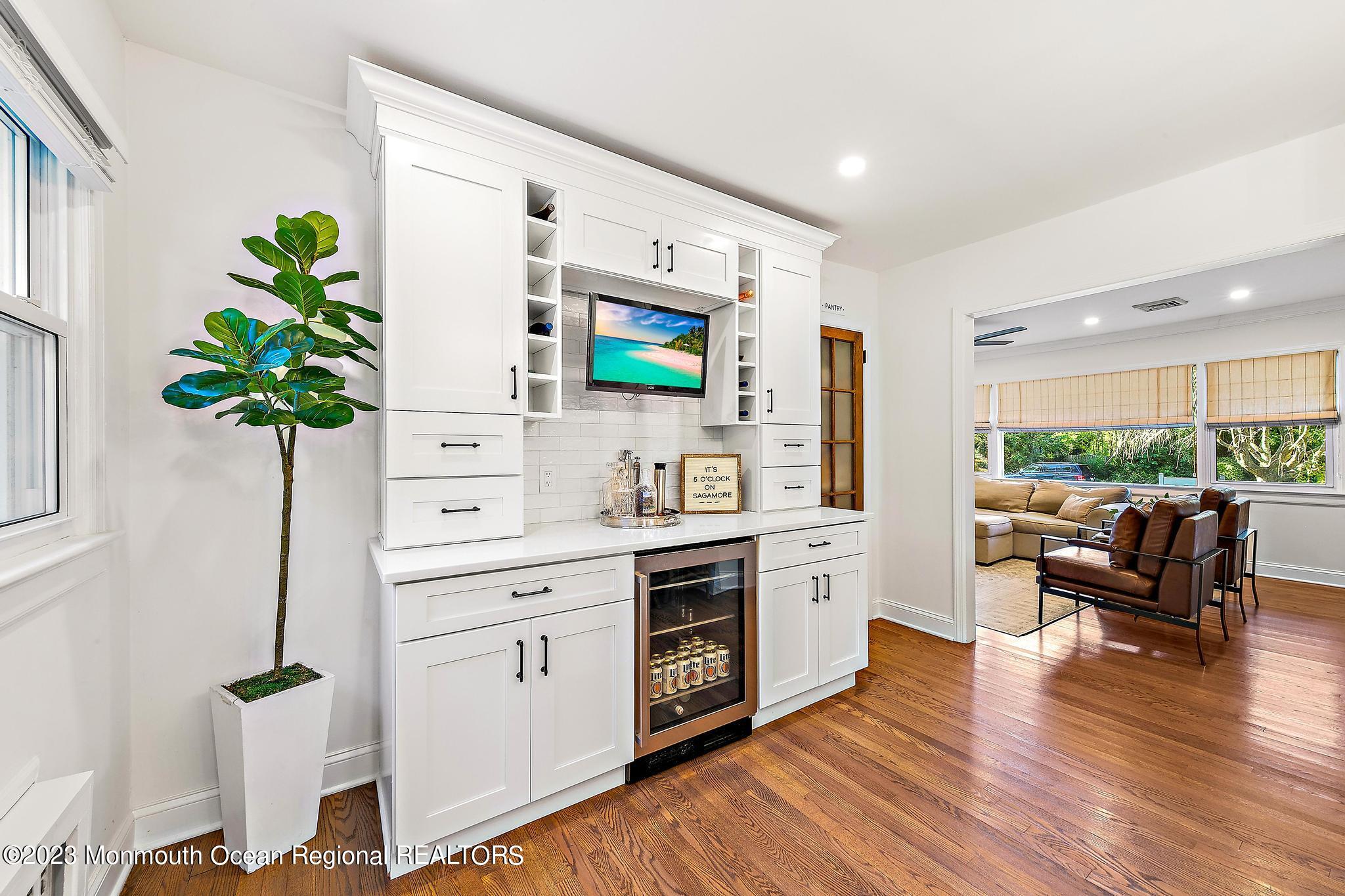 7 Sagamore Avenue Oceanport, NJ 07757 - Photo 21 of 44 a kitchen with stainless steel appliances a white stove top oven and a potted plant