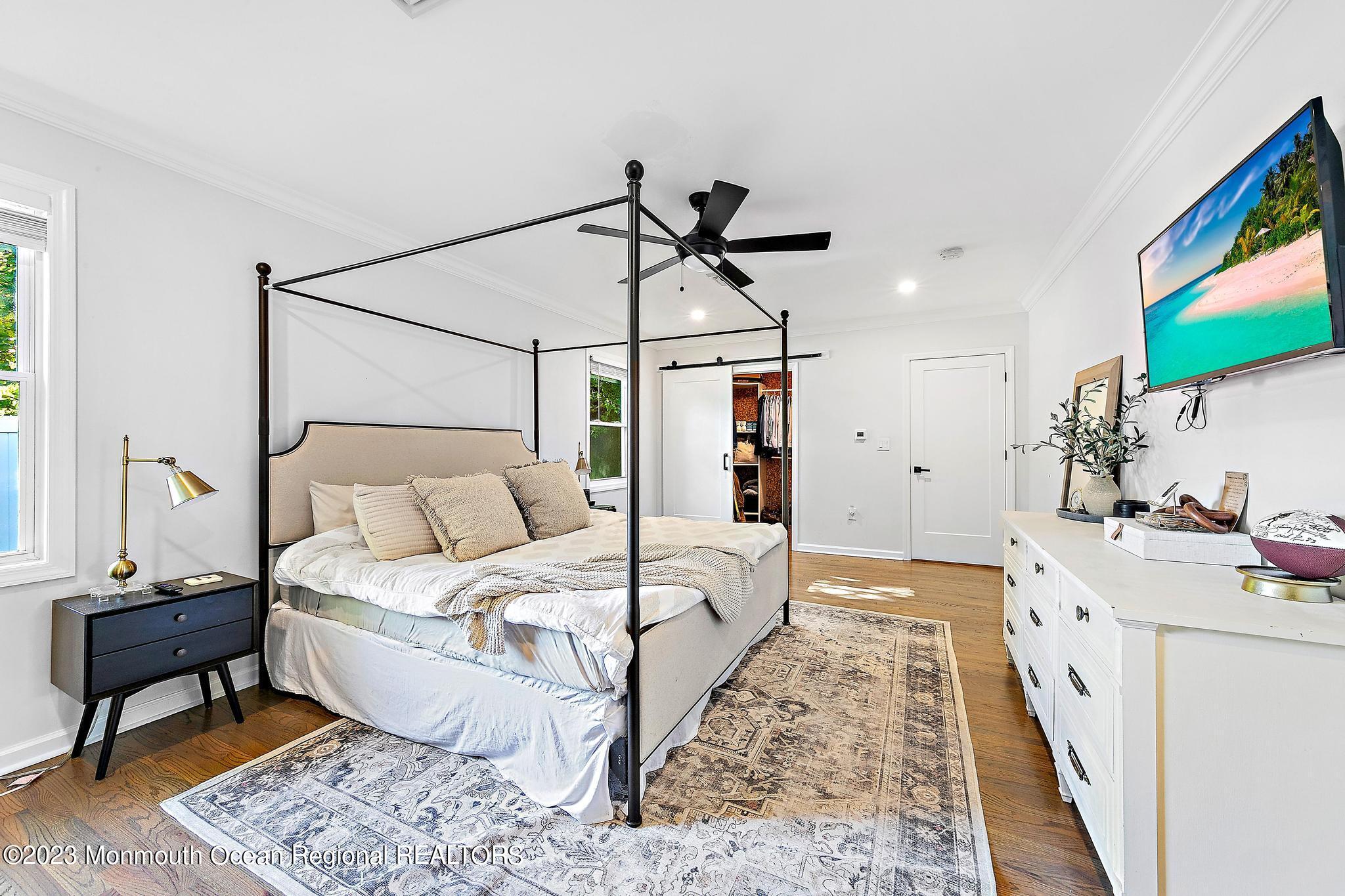 7 Sagamore Avenue Oceanport, NJ 07757 - Photo 24 of 44 a bed room with a bed and a chandelier