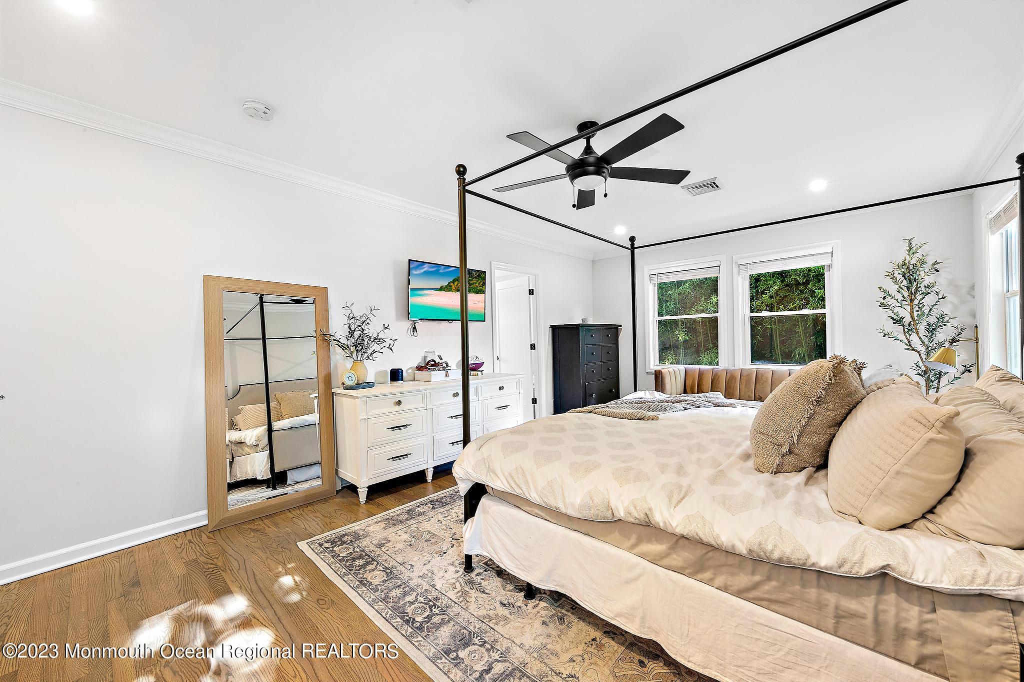 7 Sagamore Avenue Oceanport, NJ 07757 - Photo 25 of 44 a bedroom with a large bed and wooden floor