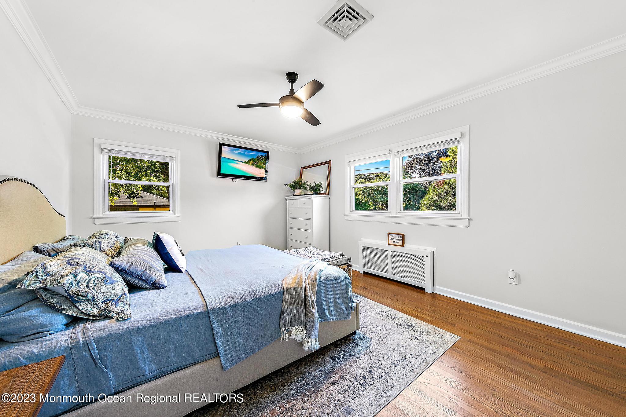7 Sagamore Avenue Oceanport, NJ 07757 - Photo 33 of 44 a bedroom with a bed and wooden floor