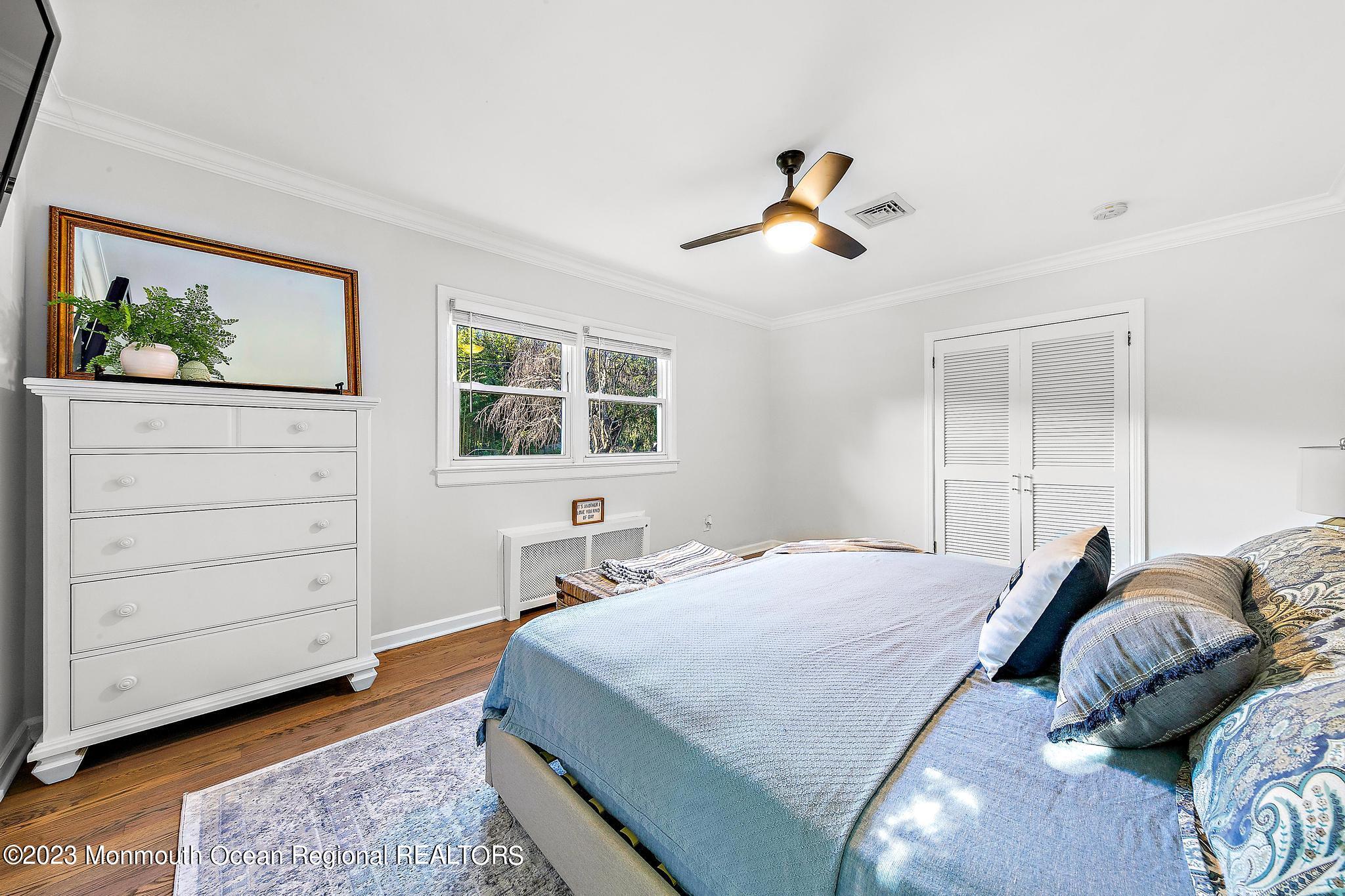 7 Sagamore Avenue Oceanport, NJ 07757 - Photo 35 of 44 a bedroom with a bed a dresser and window