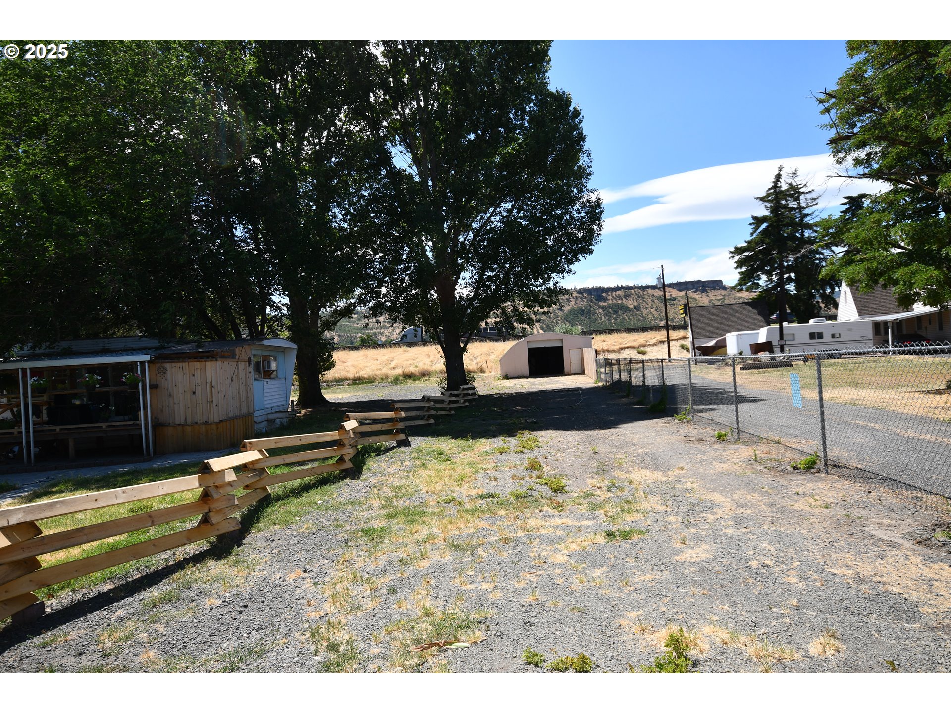 a view of a backyard of the house