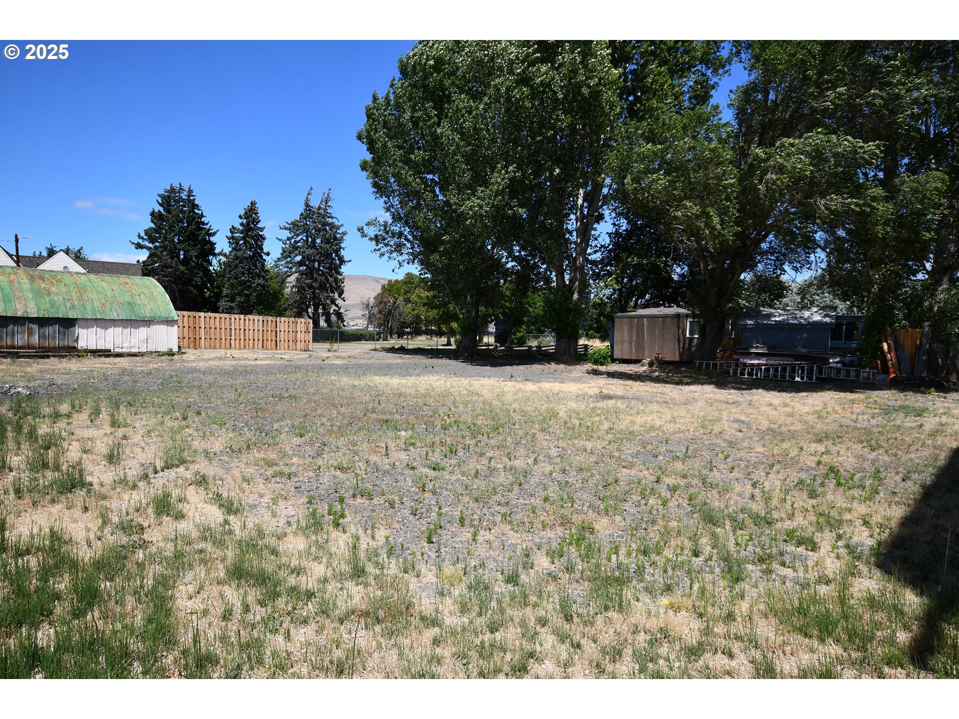 West 2nd Street The Dalles, OR 97058 - Photo 24 of 31 a view of a yard with trees
