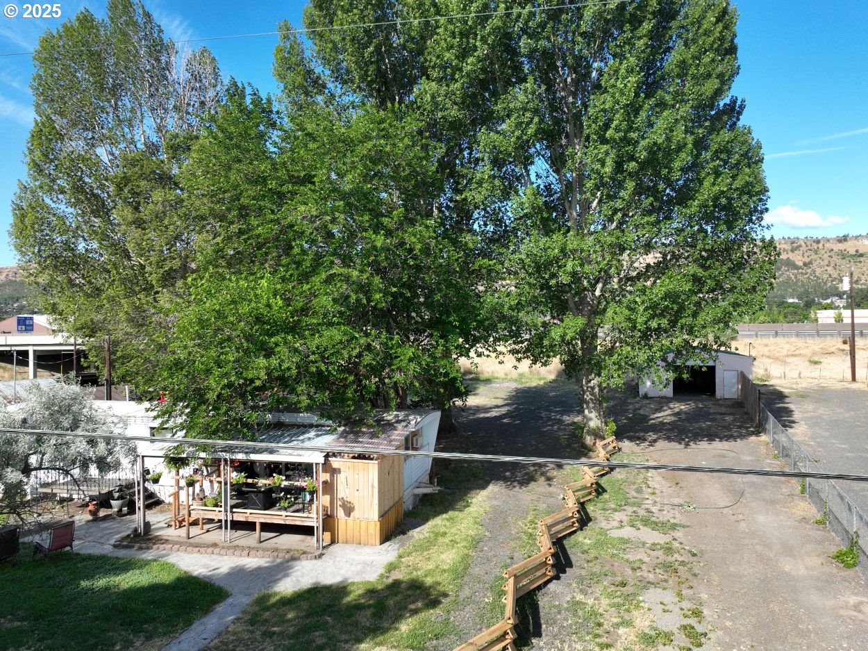 West 2nd Street The Dalles, OR 97058 - Photo 5 of 31 a view of a yard with plants and a barbeque